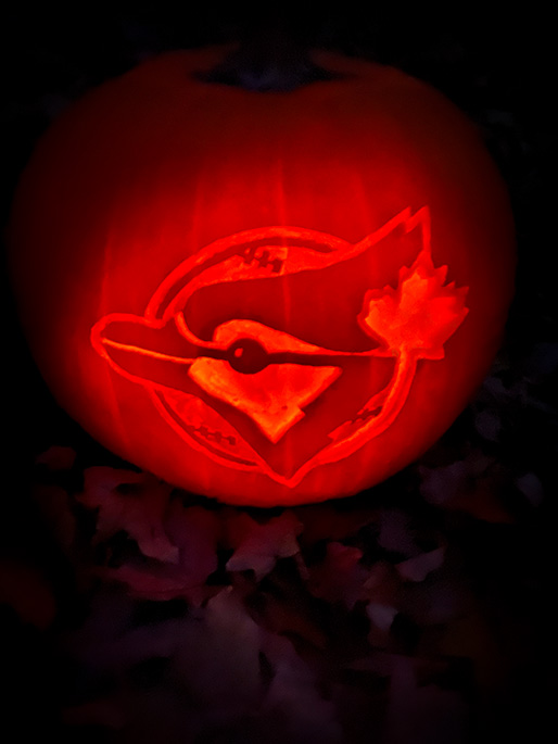 Jack-o-latern carved with a Toronto Blue Jay logo