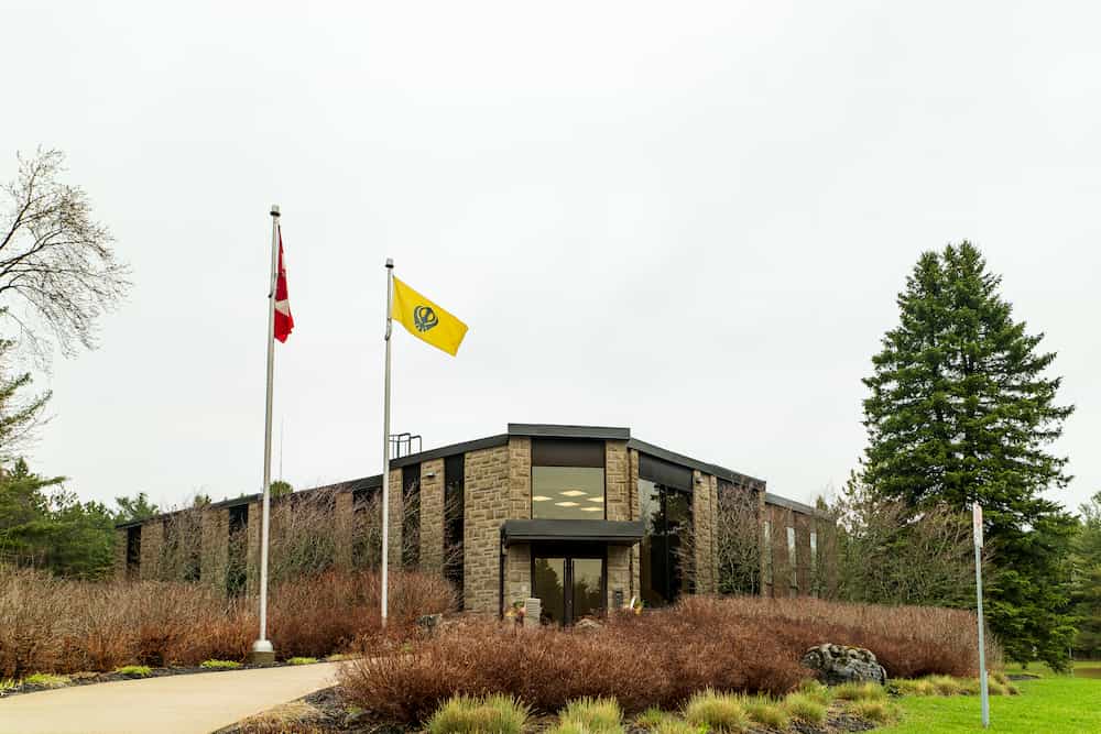 Mono Town Hall flying the Sikh Flag after its flag raising ceremony for Sikh Heritage Month