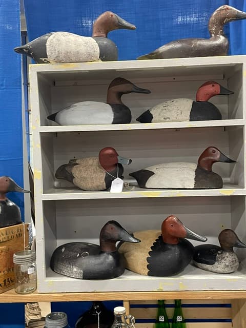Shelf with several wooden loons