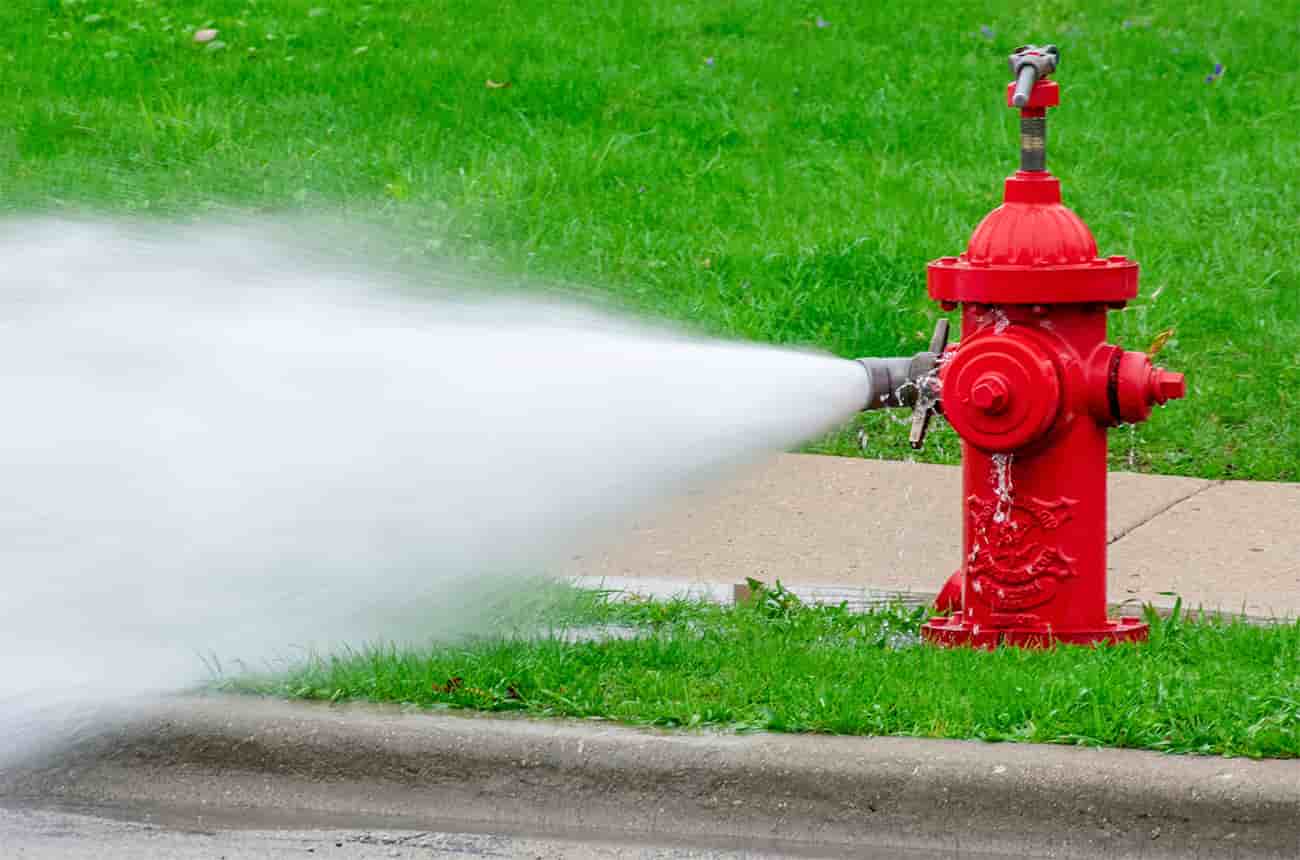 Fire hydrant being flushed
