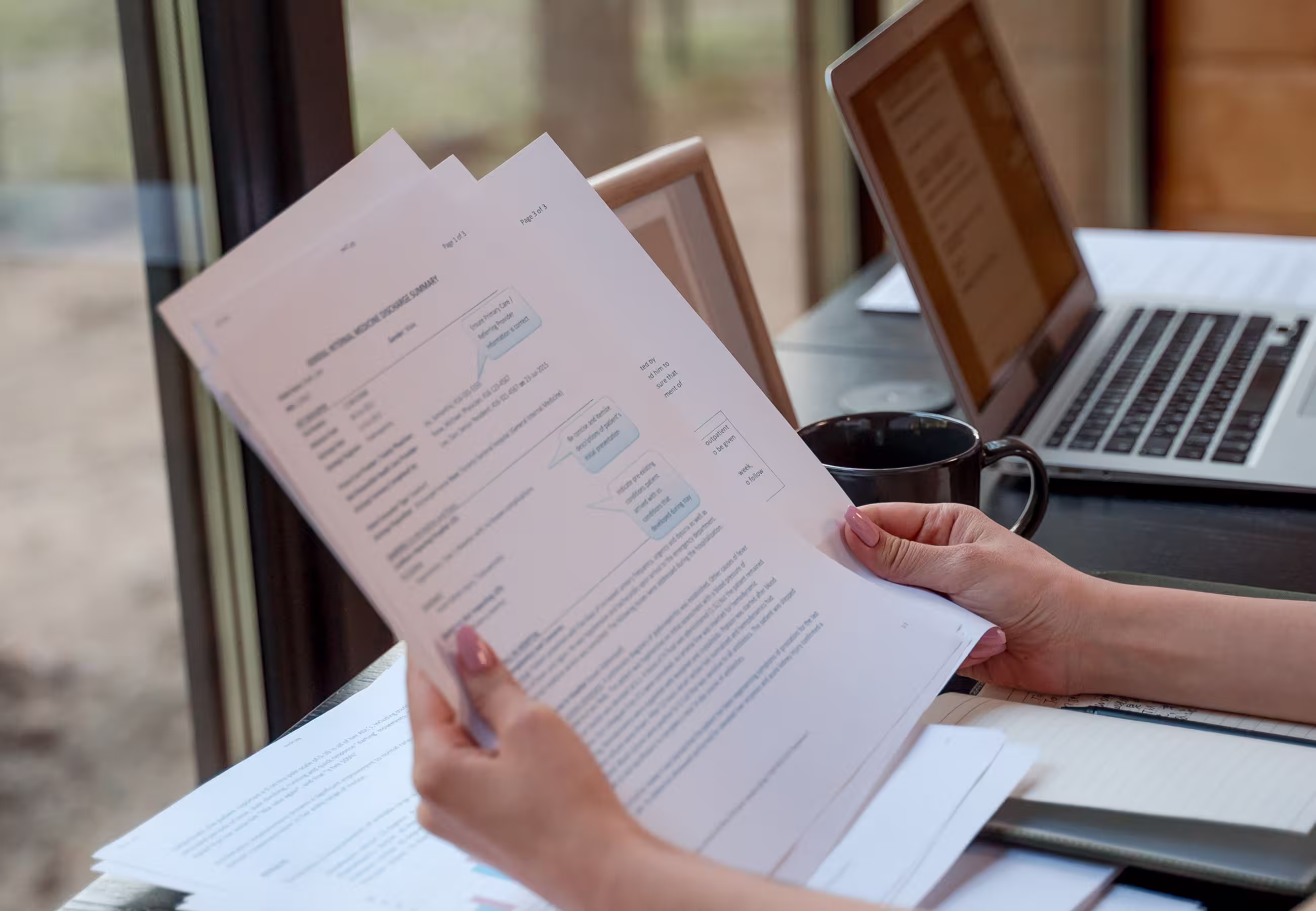 Person reviewing documents at a desk