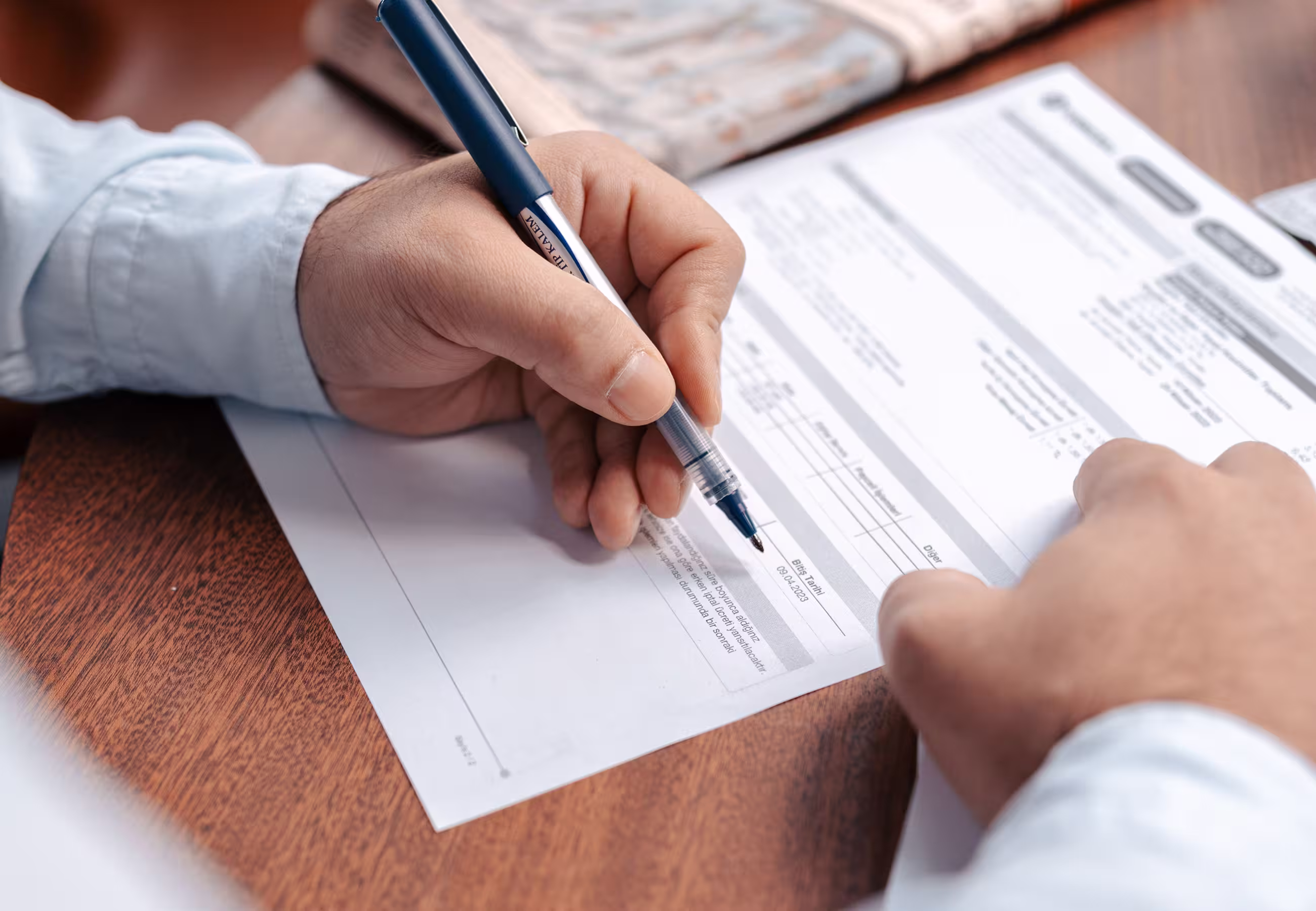 Person completing an immigration form