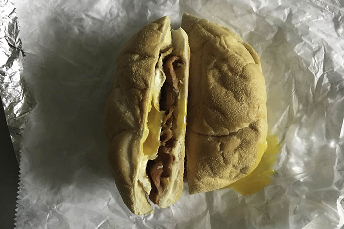 The eggs are made to order. Here the over medium yolk seductively spills out of the roll