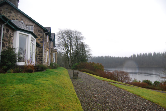 A new extension which takes advantage of the beautiful light and southerly view over the loch, and provides easy access to a partially roofed terrace.