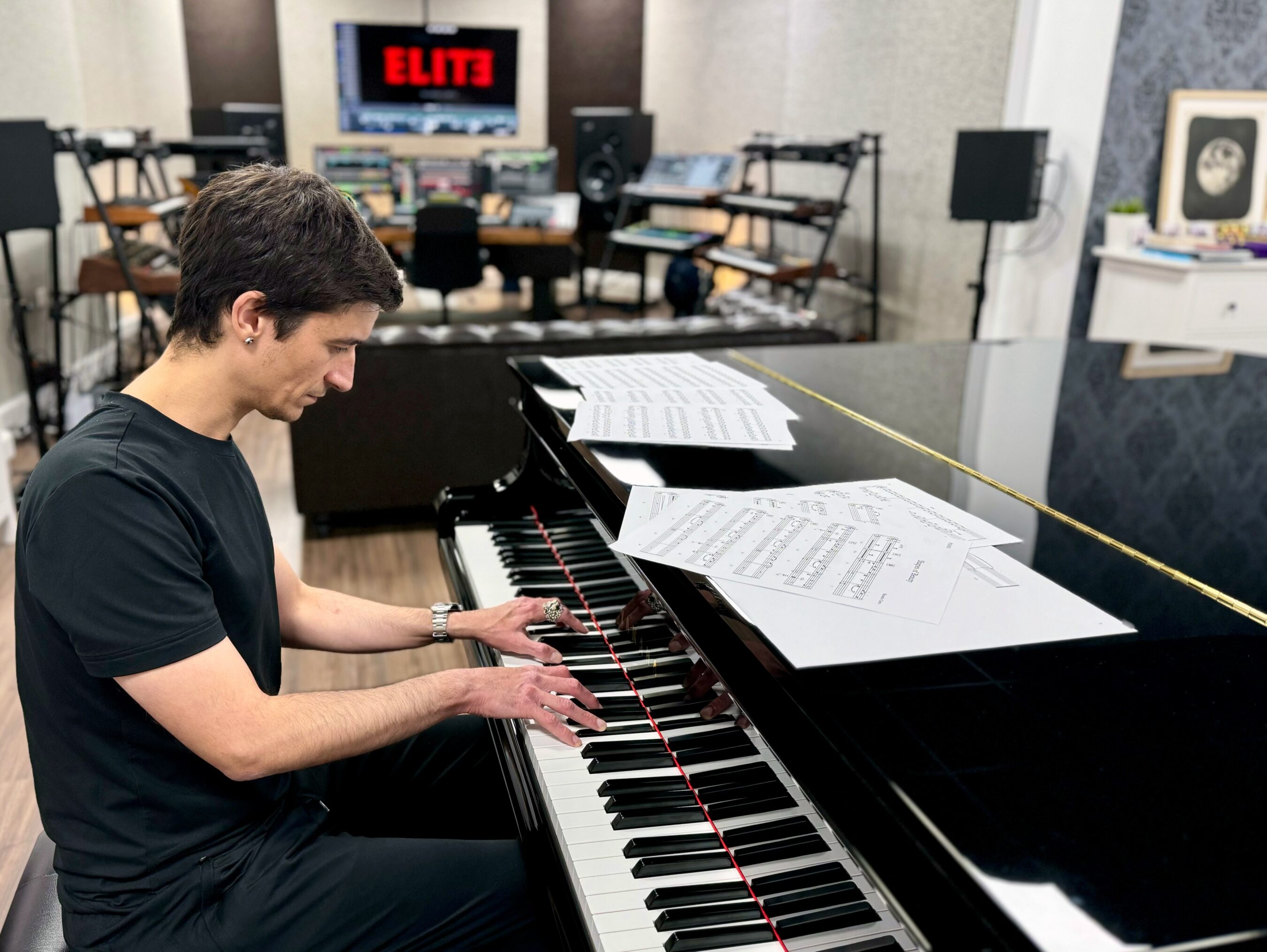 Ricardo Curto playing piano in his recording studio