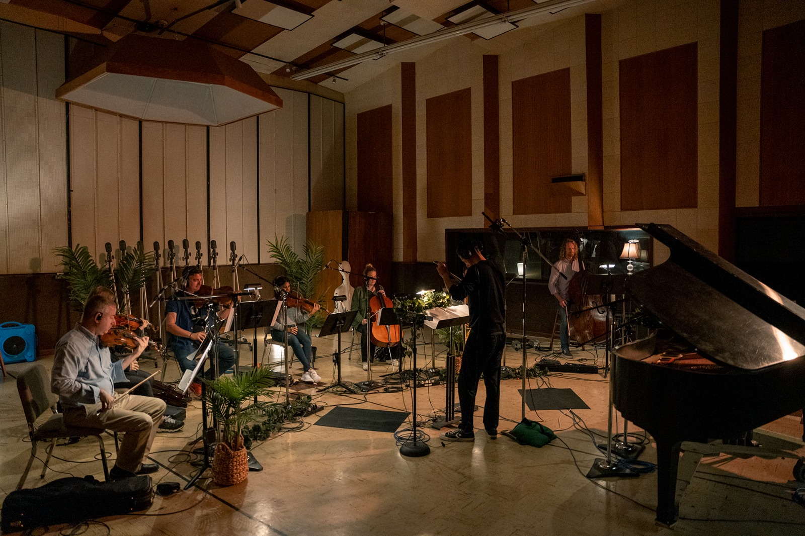 Composer Ricardo Curto conducting a string section