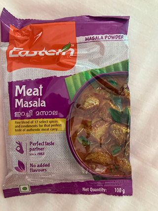 Packet of Eastern Meat Masala powder, purple and white packaging with an image of spiced meat curry.