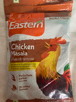 Eastern Chicken Masala spice mix package featuring a colorful rooster illustration and text highlighting 14 select spices, no added flavors, and perfect taste.