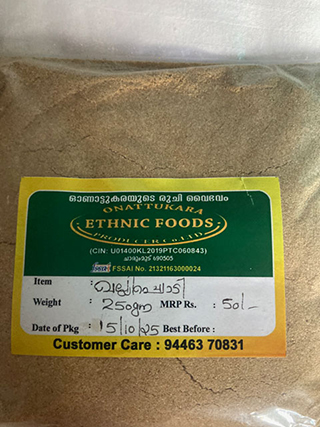 Packet of brown powder labeled Ethnic Foods with handwritten details: item name in Malayalam, weight 250 gm, MRP 50 INR, date of packaging 15/10/25, and customer care number 94463 70831.