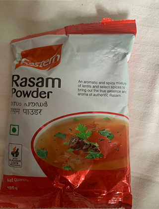 Packet of Eastern Rasam Powder with an image of a bowl of rasam garnished with coriander on the front.