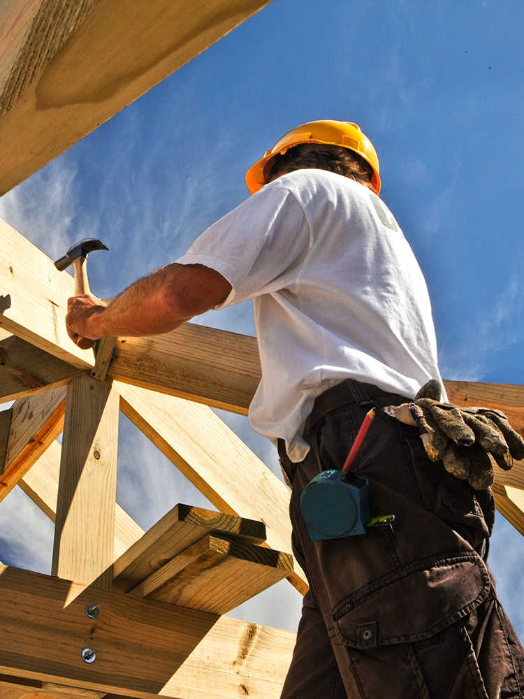 a temp worker demoing a structure