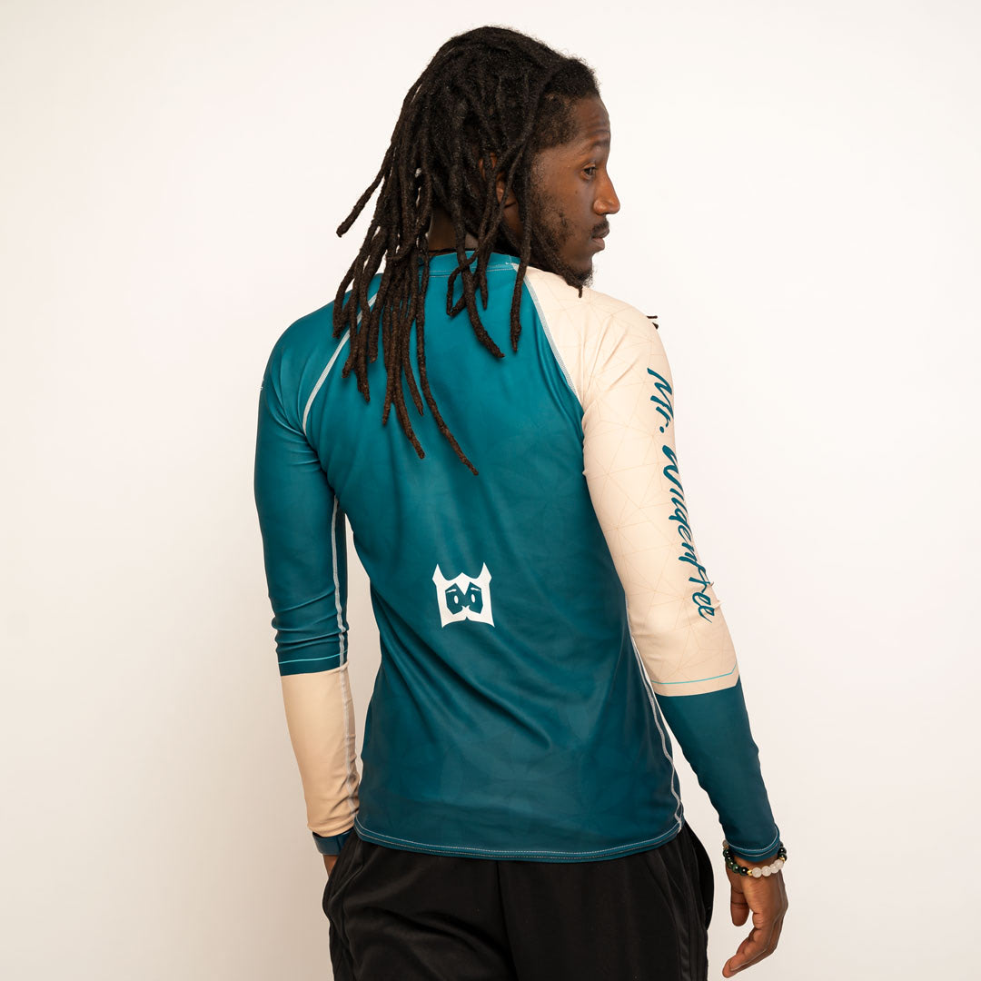 Wildenfree Teal Rashguard, Back with "Lil W" emoji in white, towards the lower-mid back