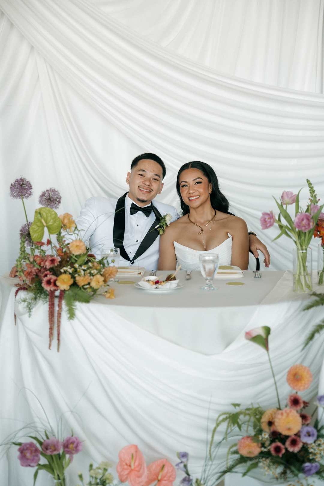 Bride and groom at their sweetheart table.