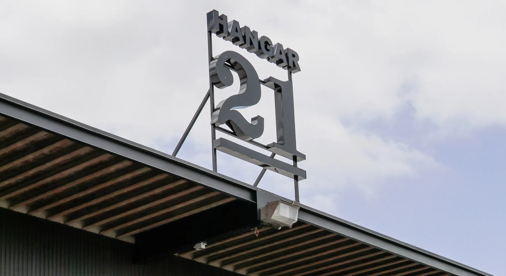 Hangar 21 sign above the venue roof
