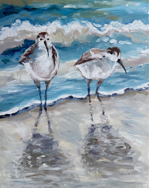 Two sweet shore birds walking along the beach with soft blue waves and reflections in the sand. A calm, coastal watercolor-style painting with light, airy colors and a peaceful seaside vibe