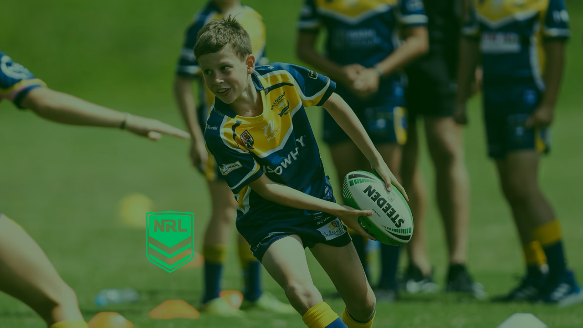Kid throwing a rugby league ball next to the NRL logo
