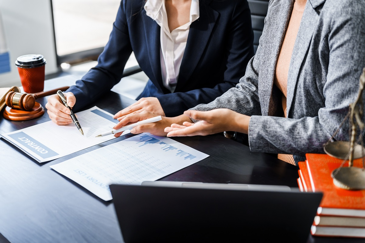 Investors reviewing financial and legal documents in a data room during the due diligence process