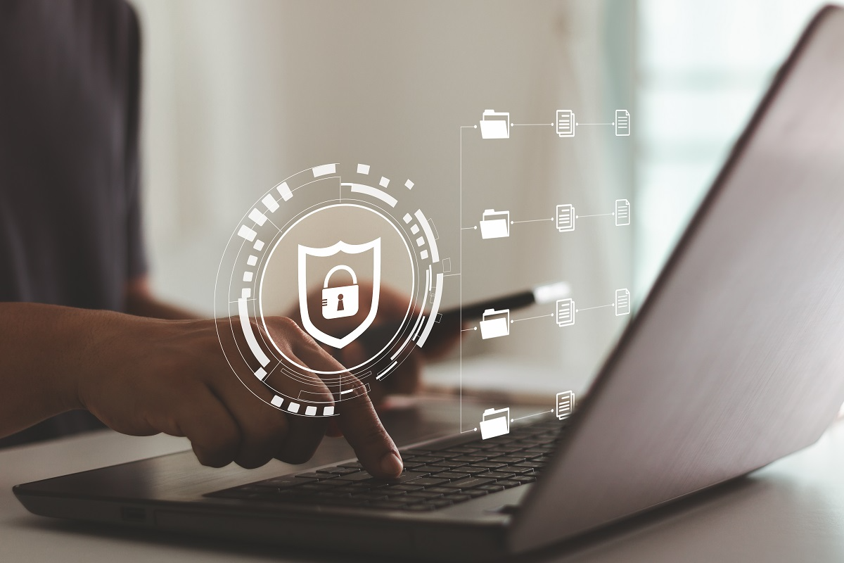 User accessing a secure virtual data room with encryption and document permission controls displayed on a laptop