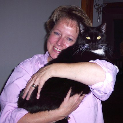 Brenda holding cat 'Jill'