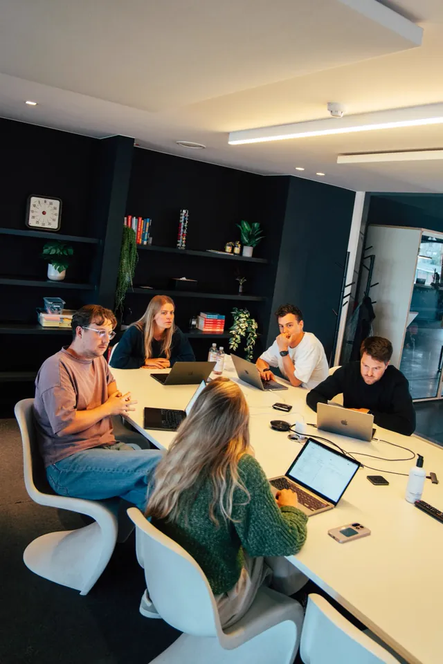 The Nimble team in a meeting around a table