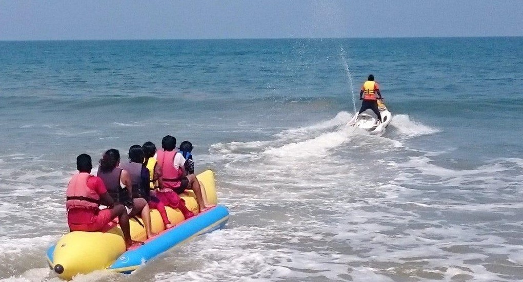 Family Enjoying water sports banana ride in Andaman