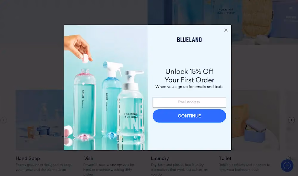 A two-step popup form on Blueland's website that offers the shopper 15% off their first order if they sign up for emails and texts. The first step of the form has a field for the shopper's email address.