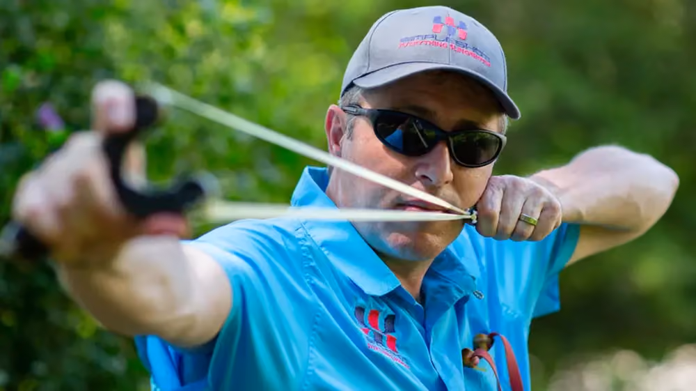 SimpleShot founder Nathan Masters using a slingshot