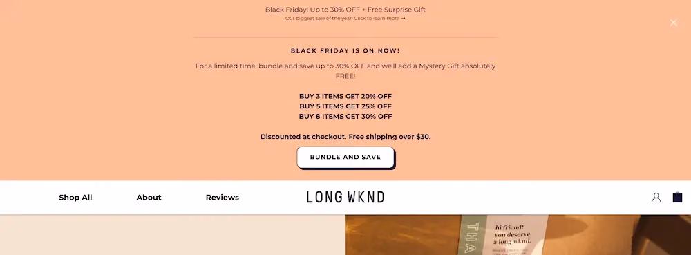 Long Wknd's sticky bar expands to show different tiers of discounts depending on how much a shopper buys ranging from 20% off three items up to 30% for eight items.