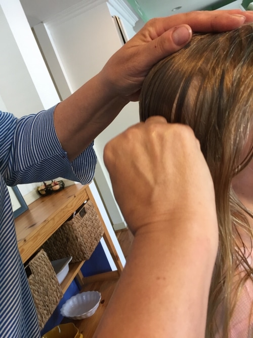 young girl receiving lice treatment southern california