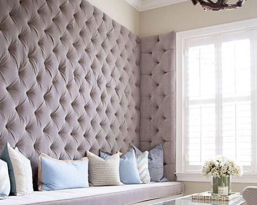 Bare wall before custom upholstered wall installation by Manilla Upholstery