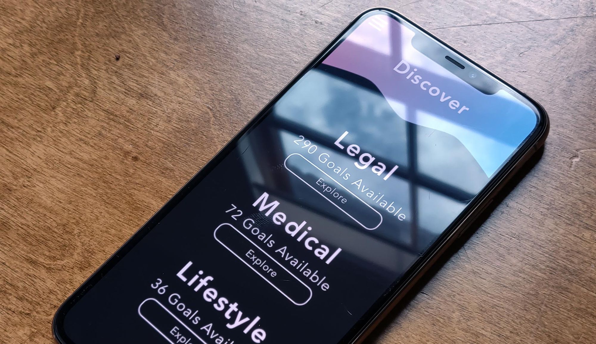 Phone displaying the Solace app on a hardwood table