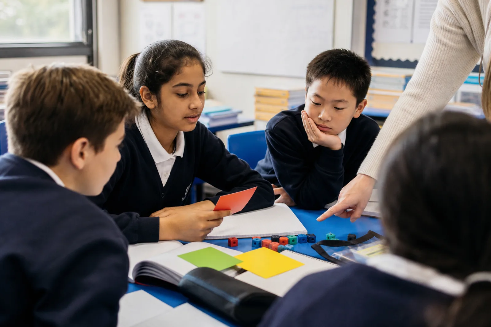 Learners use reflection cards to check their strategy choice during a classroom task.