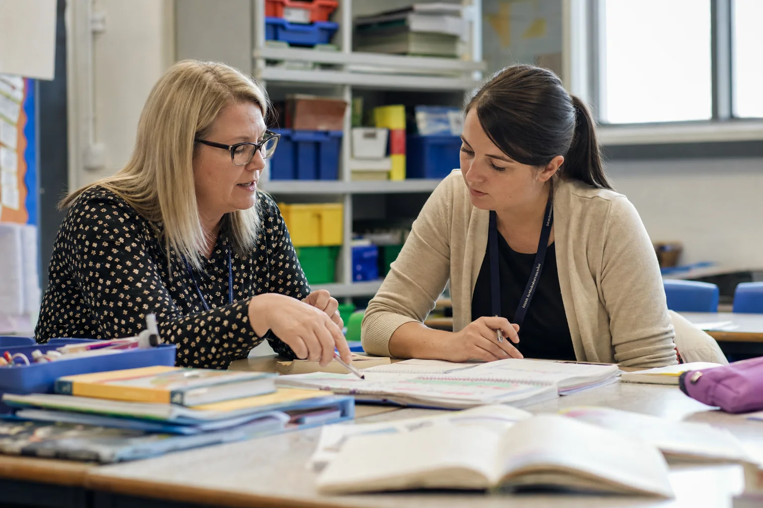 Teachers plan targeted support for learners in a teacher planning setting.