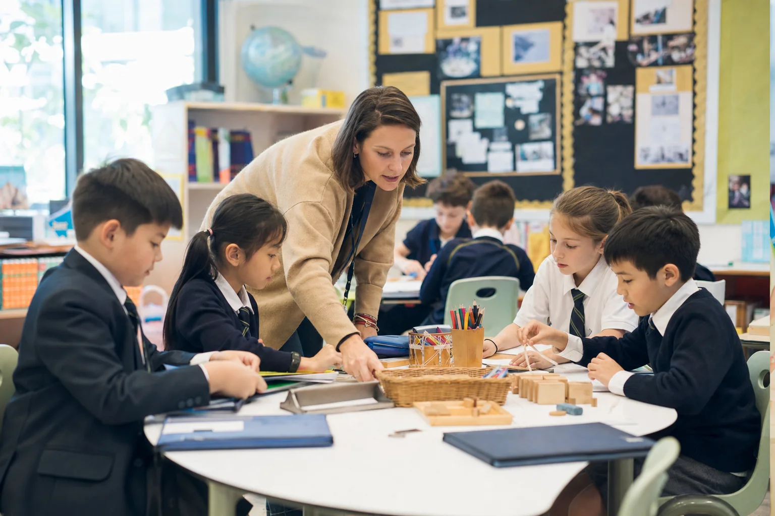 Teacher and learners use inquiry journals, concept questions and teacher facilitation in an International Baccalaureate classroom.