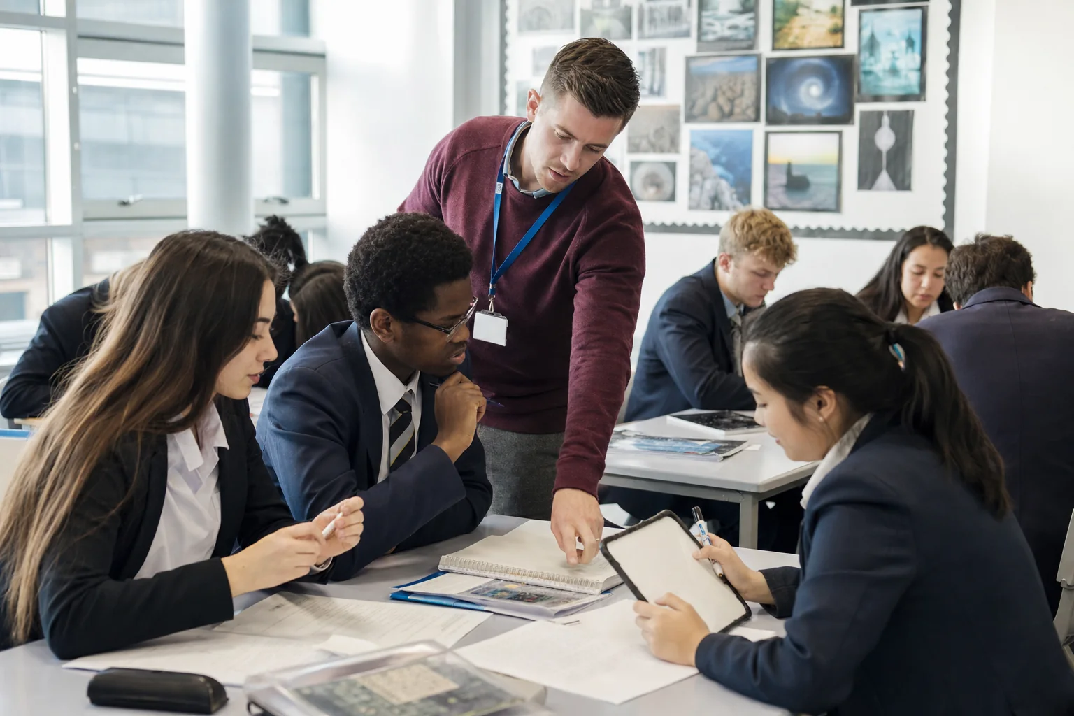 Teacher and learners use source packs and teacher conferencing during Diploma Programme study in an International Baccalaureate classroom.
