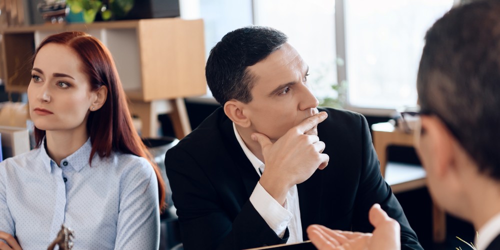 man and woman in discussion with business advisor