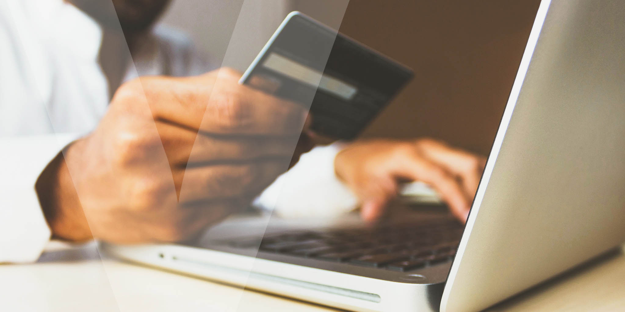 A person using their credit card to pay online