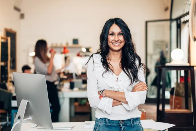 A smiling woman employee in an office environment