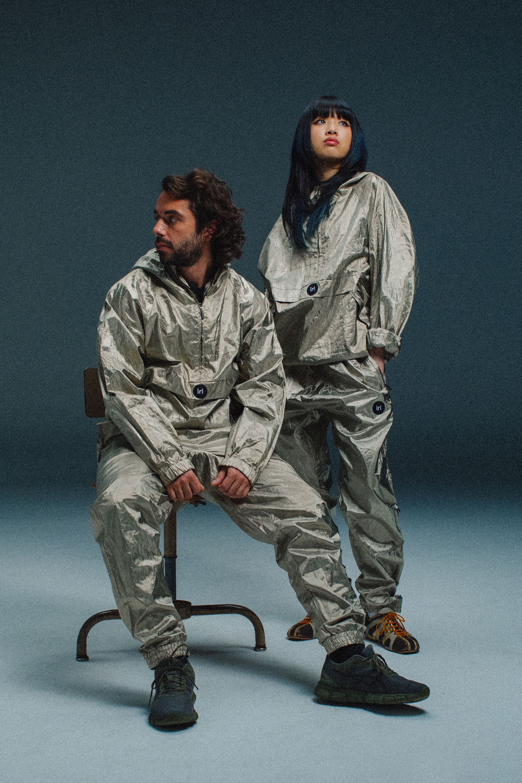 IRL Tracksuit — seated duo