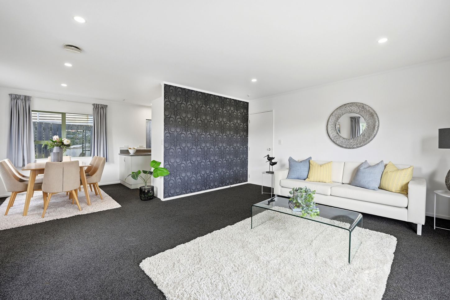 Knott Road, Stanmore Bay - lounge with feature wall and dining