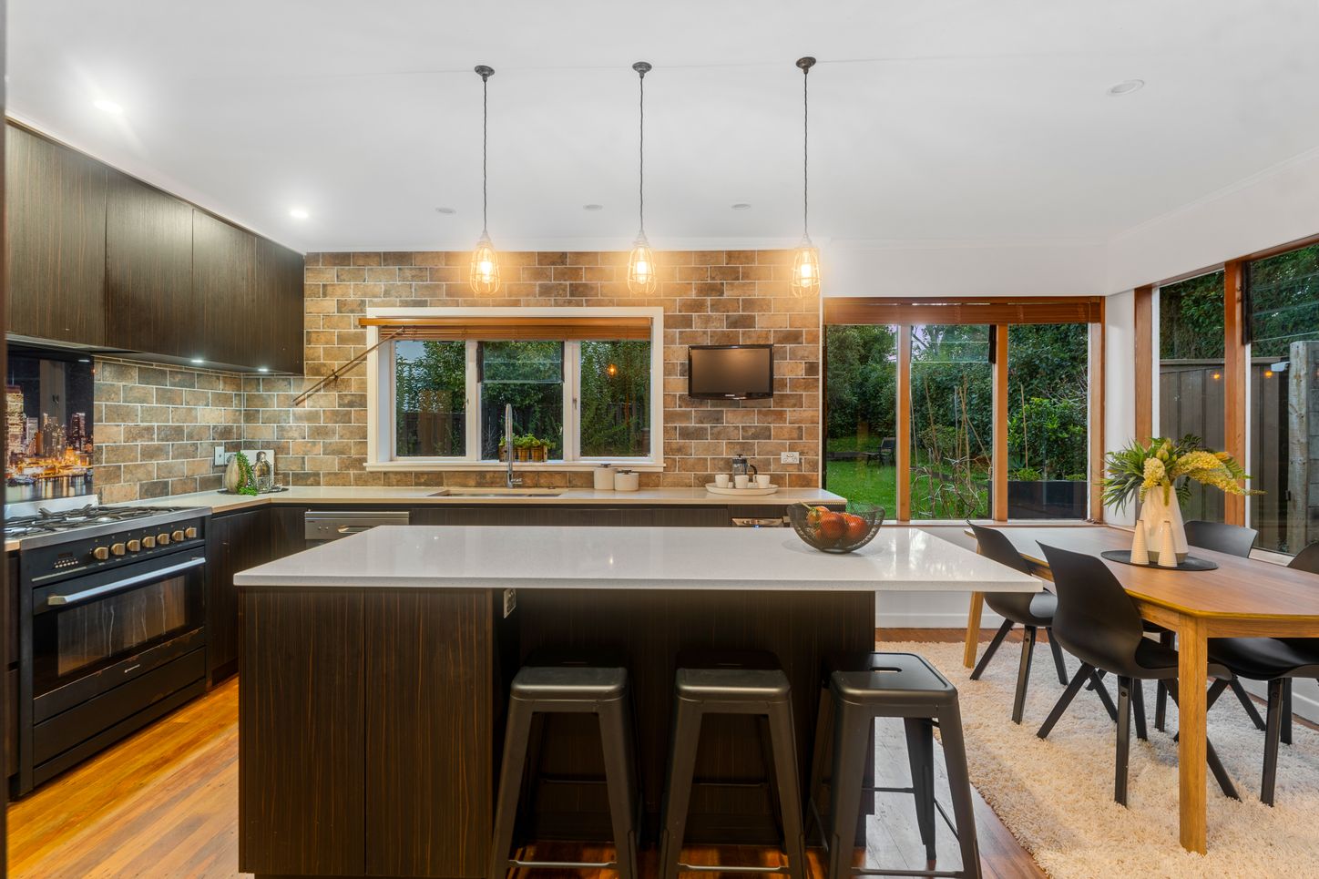 Forest Hill Road - kitchen with brick splashback and dark cabinetry