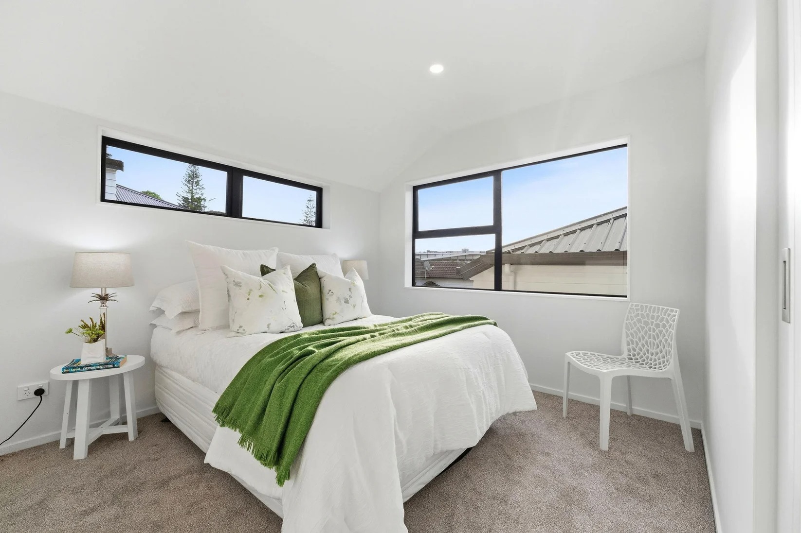 Marlborough Avenue - bedroom with green throw and styled chair