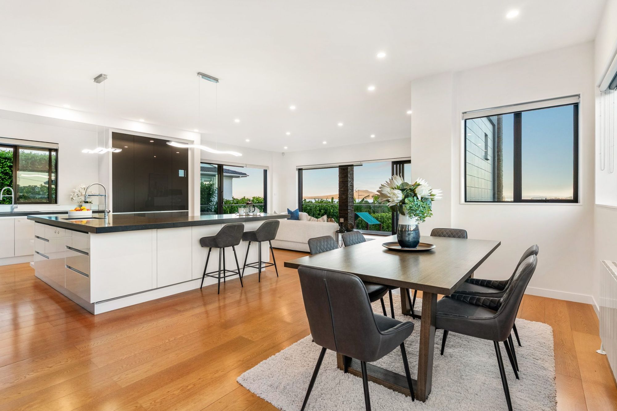 Seaview Road, Castor Bay - white kitchen with island and bifolds