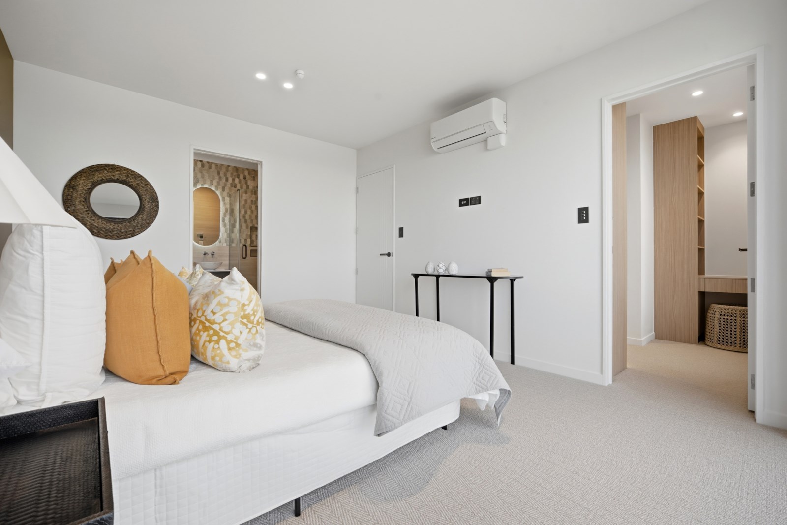The Terrace, Takapuna - bedroom styled with warm gold accents