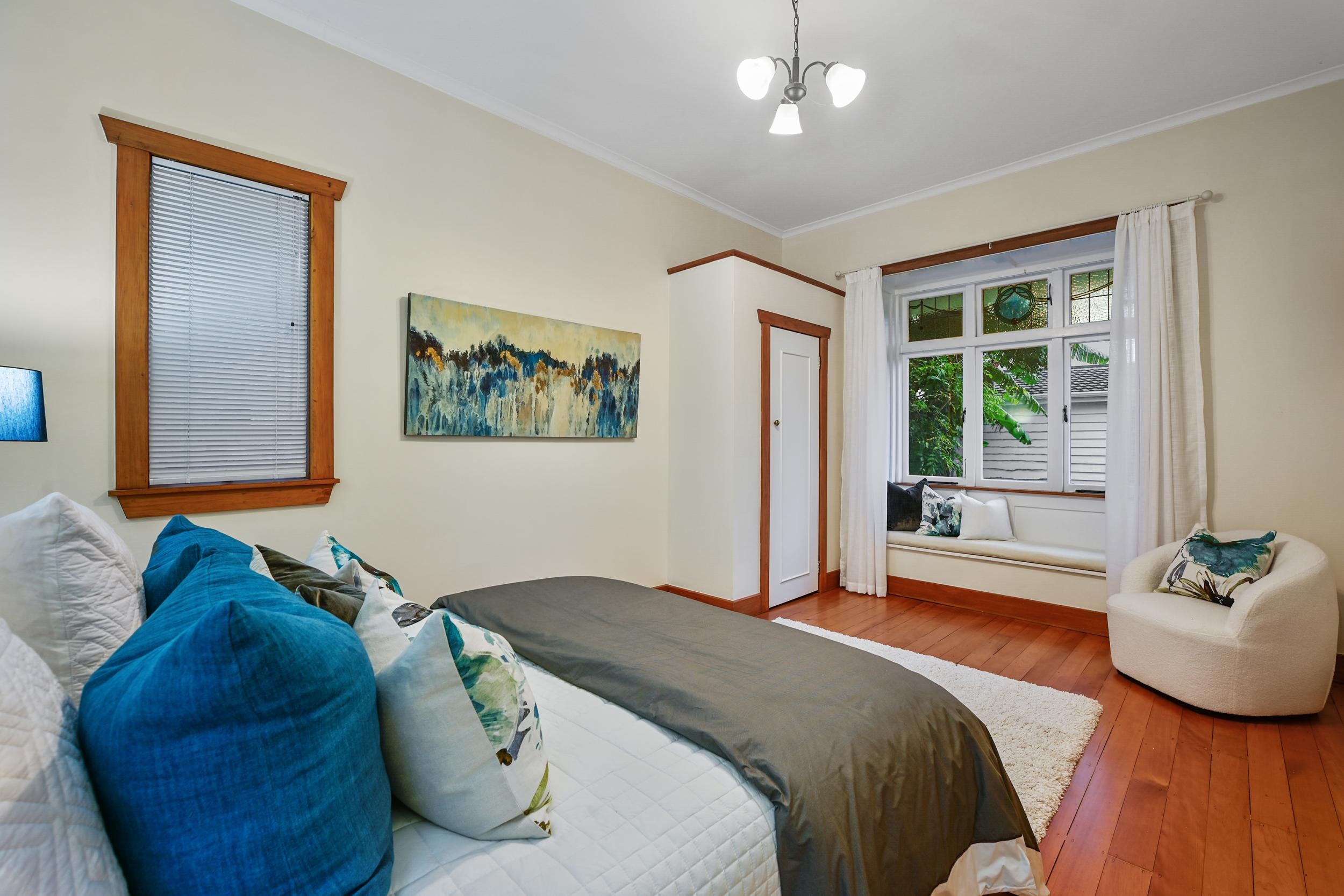 59 Clarence Street, Devonport - bedroom with teal accents and kauri floors