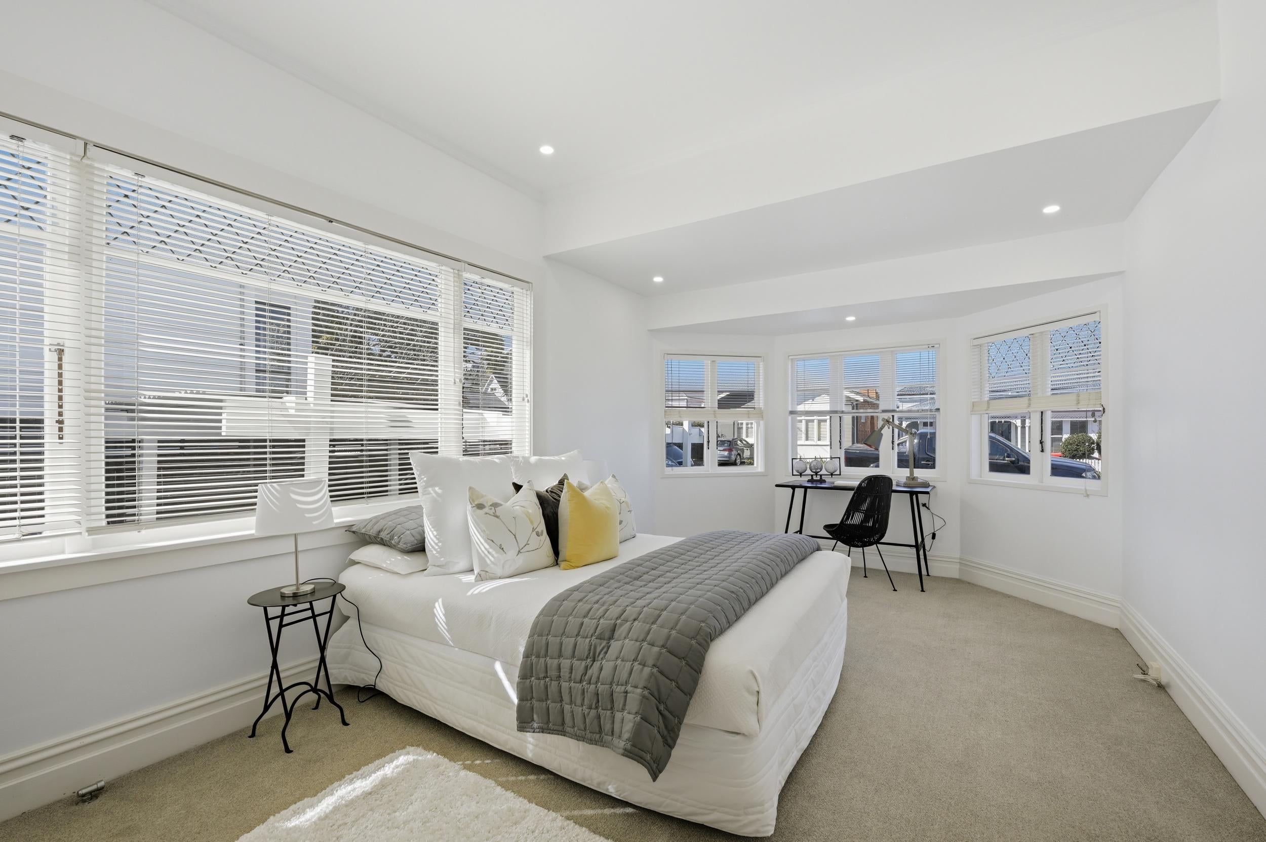 Huia Street, Devonport - bedroom styled with occasional chair