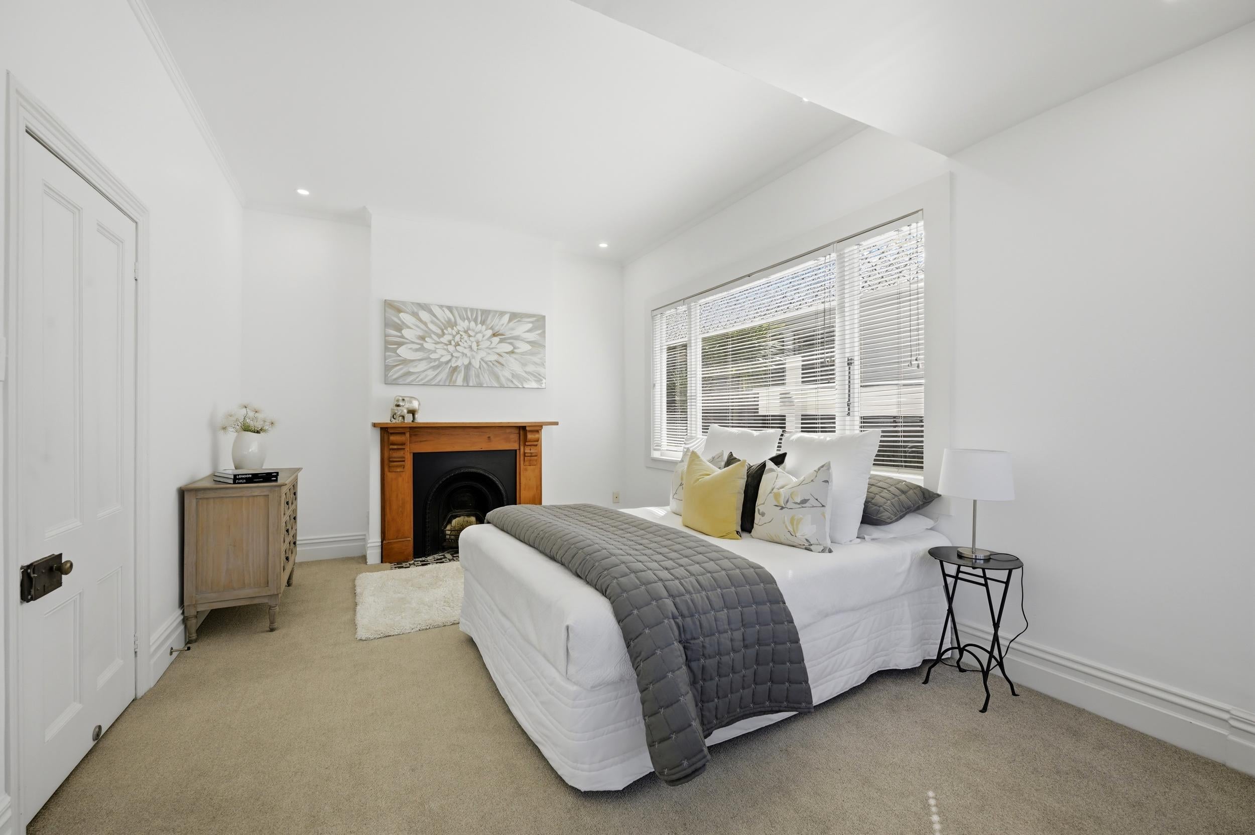 Huia Street, Devonport - main bedroom styled with armchair
