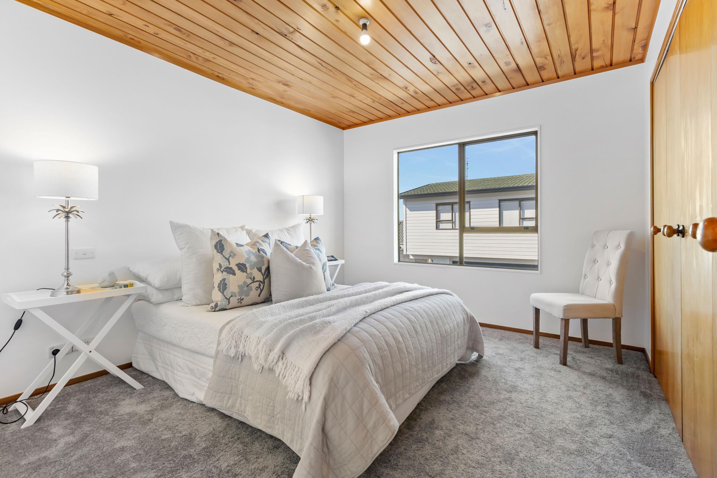 Churchill Road, Murrays Bay - bedroom styled with bedside lamps