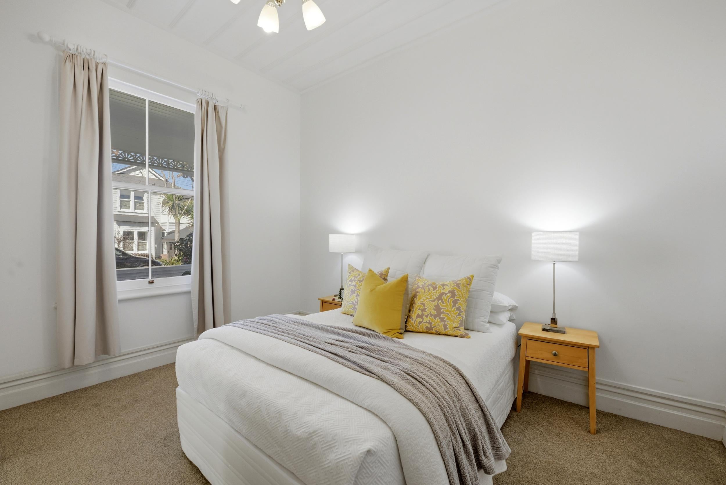 Huia Street, Devonport - bedroom styled with bedside lamps