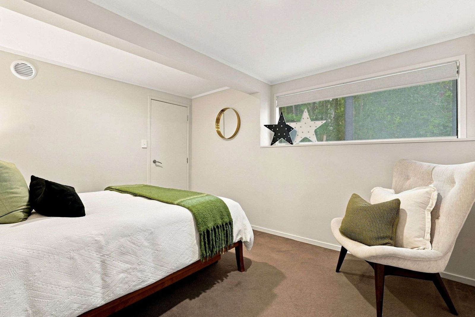 Beach Road, Campbells Bay - bedroom styled in soft greens